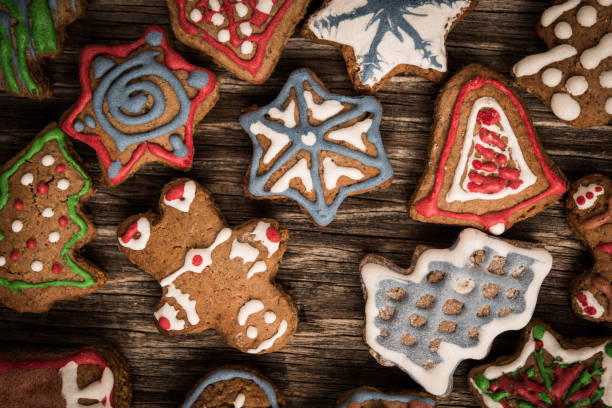 istock Gingerbread cookies over wooden background 866928828