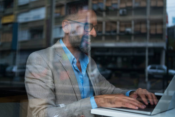 istock Dedicated Businessman Working At Cafe 866929518