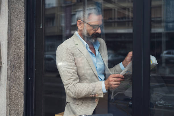 istock Dedicated Businessman Working At Cafe 866929834