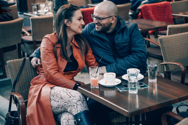 istock Couple in love drinking coffee in coffee shop 866933486