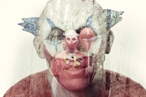 istock double exposure of a scary clown 866936540