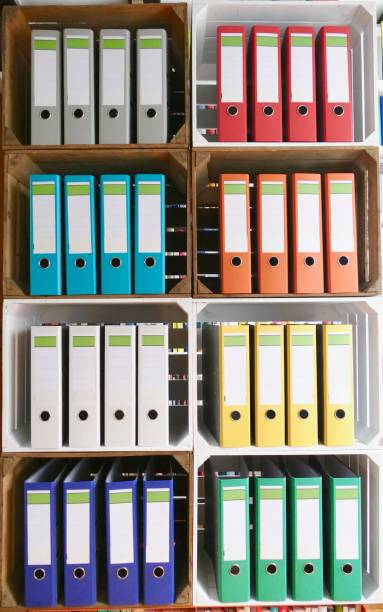 istock Colorful ring binders in wooden boxes, vertical 866940392