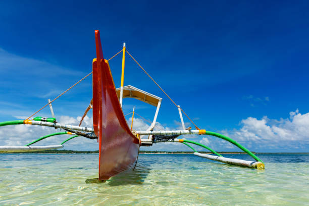 istock Traditional fishing boat on pristine beach, Philippines 866944228