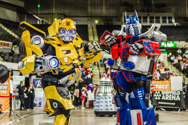 Cosplayers dressed as 'Bumblebee' and 'Optimus Prime' from the Transformer series at the Yorkshire Cosplay Convention at Sheffield Arena.