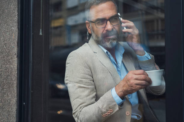 istock Dedicated Businessman Working At Cafe 866947618