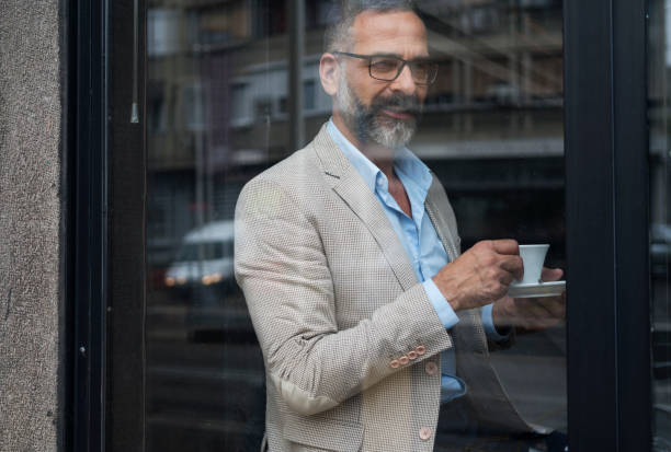 istock Dedicated Businessman Working At Cafe 866947706