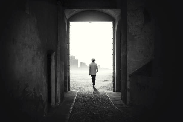 Man walking out from a dark alley