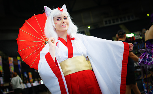 Cosplayer dressed as the character 'Amaterasu' from the video game 'Okami' at the Yorkshire Cosplay Convention at Sheffield Arena.