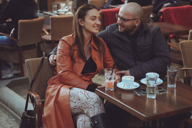 istock Couple in love drinking coffee in coffee shop 866947890