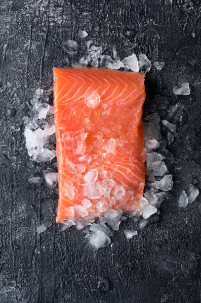 Fresh salmon fillet. Vertical photo.