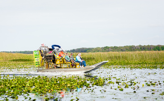 Air boat ride with passengers on Lake Tohopekaliga in Kissimmee, Florida.
