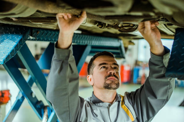 istock Professional mechanic repairing a car. 866955268
