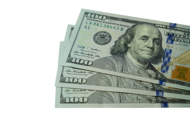 istock close up hundred dollars bank notes isolated on white background 866966060