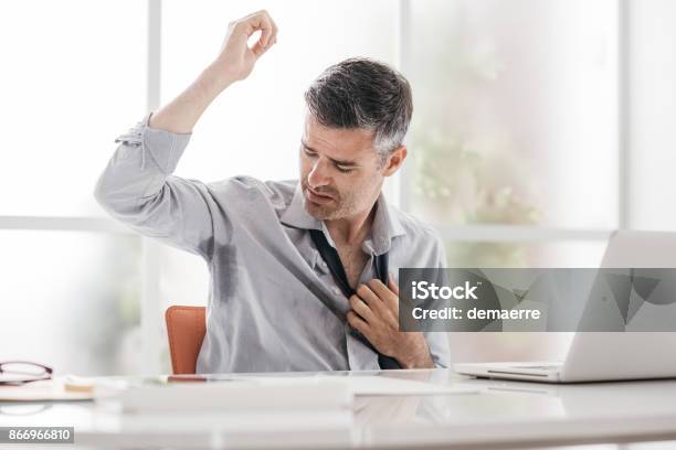 Nervous Businessman Sweating Stock Photo - Download Image Now - Sweat, Men, Office