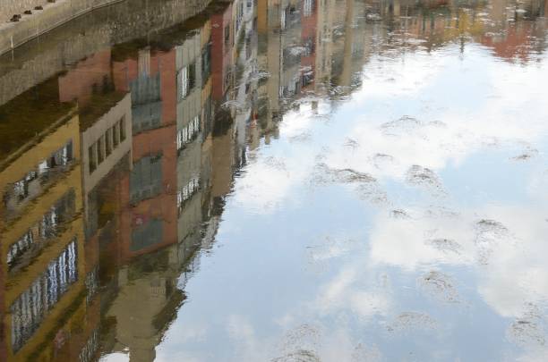 istock Reflects of buildings on river 866969114
