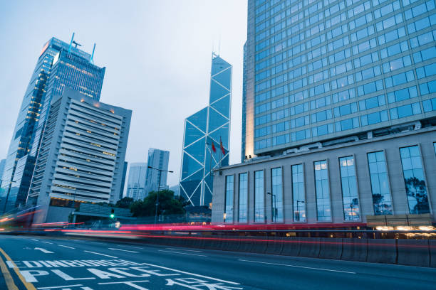 istock traffic trails in downtown hong kong 866973490