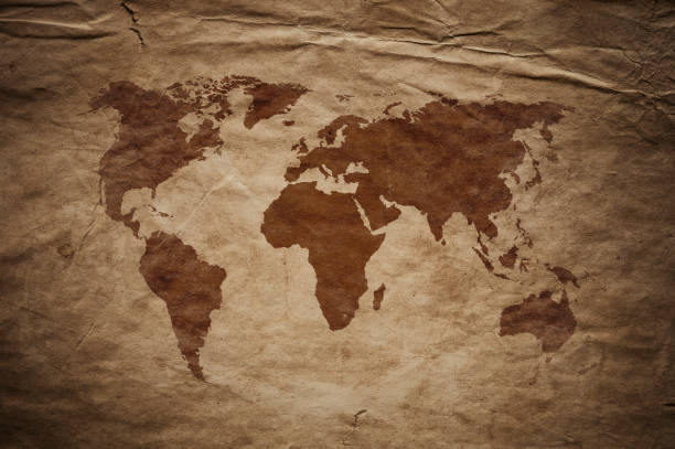 istock World Map on aged damaged paper 866975780