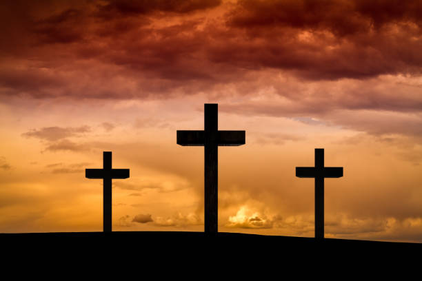 istock Jesus Christ cross in Easter Friday evening on red, orange sky, sunset 866976012