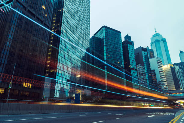 istock traffic trails in downtown hong kong 866976550
