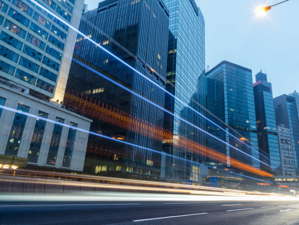 istock traffic trails in downtown hong kong 866976622