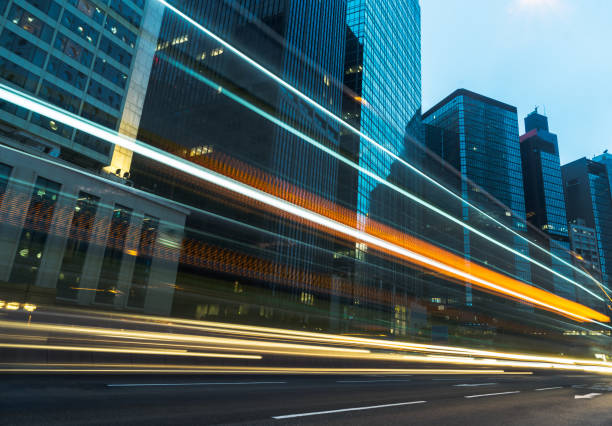 istock traffic trails in downtown hong kong 866976812