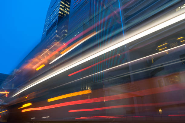 istock traffic trails in downtown hong kong 866979488