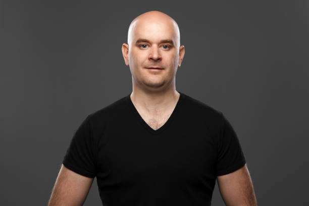 istock bald man in a T-shirt 866979756