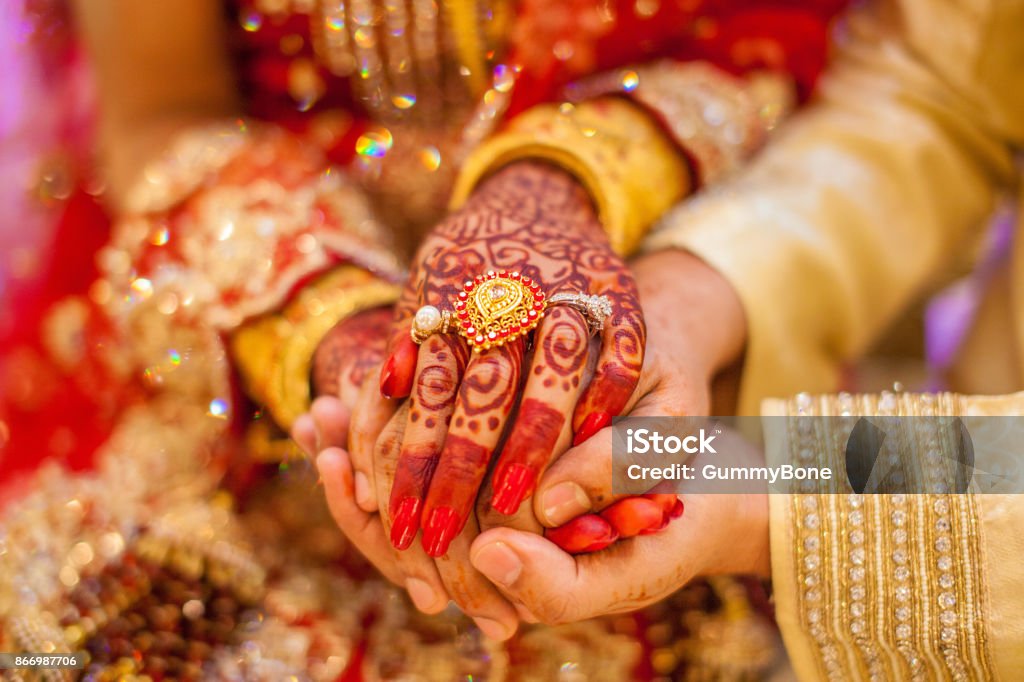 Indian wedding hands Indian wedding hands with gold Culture of India Stock Photo