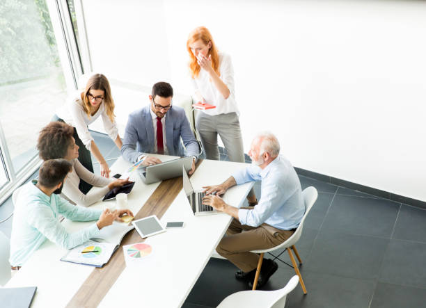 istock Joyful multiracial business team at work in modern office 866987978