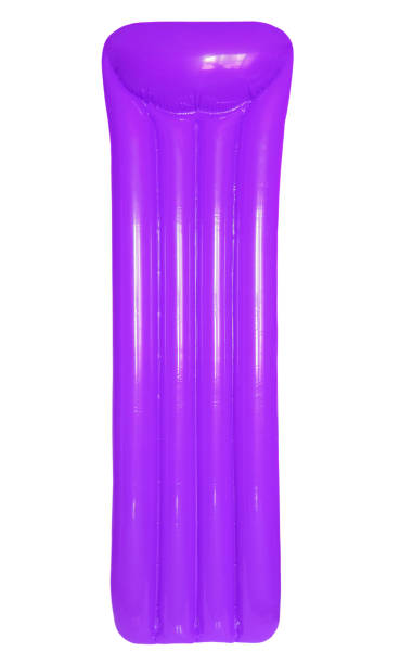 istock Purple inflatable floating pool raft mattress isolated on white background. 866988564