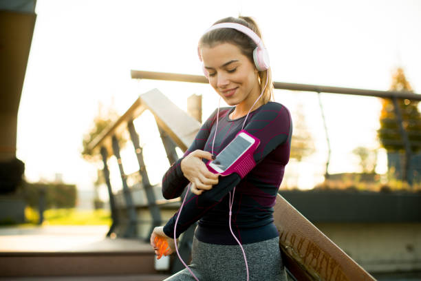 istock Pretty young woman takes a break after running 866990958