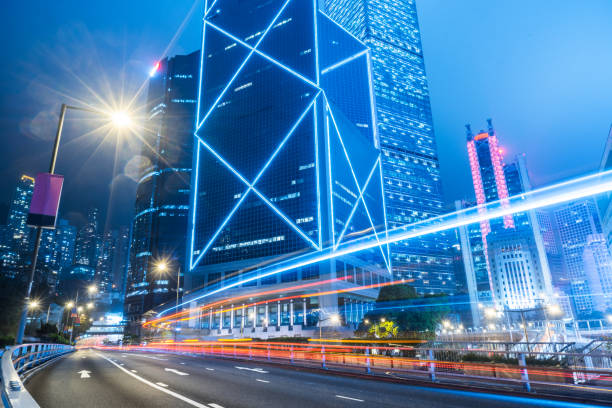 istock traffic trails in downtown hong kong 866991188