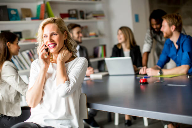 istock Businesswoman using mobile phone in office 866994548