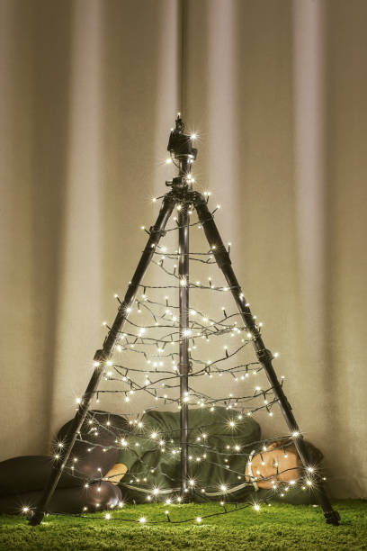 istock Christmas tree made of camera tripod 866994664