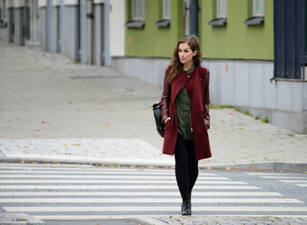 istock Woman walking home on zebra crossing 866995150