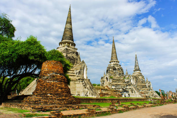 istock Ancient pagodas on red brick floor step are Ayutthaya, Thailand. This have tree and blue sky be background and ground on foreground of picture. 866998754