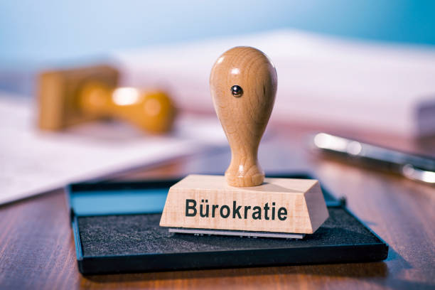 Stamp with the inscription Bureaucracy A stamp with the inscription Bureaucracy is written on a desk. pistil stock pictures, royalty-free photos & images