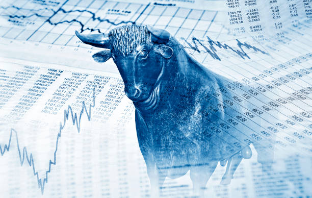 Success on the stock market Financial symbols and bull stand for success on the stock market bull market stock pictures, royalty-free photos & images