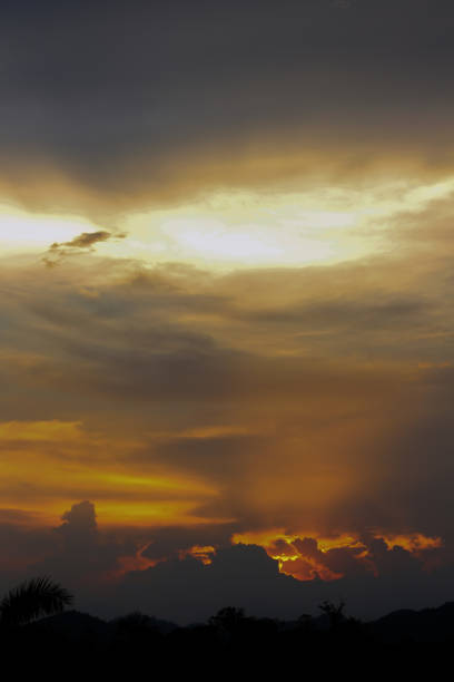 istock Hell in Heaven colorful Clouds Silhouette blue Sky Background Evening golden sunset 867010982