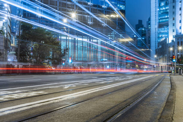 istock traffic trails in downtown hong kong 867012044