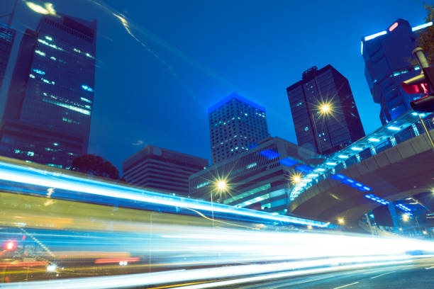 istock traffic trails in downtown hong kong 867022584