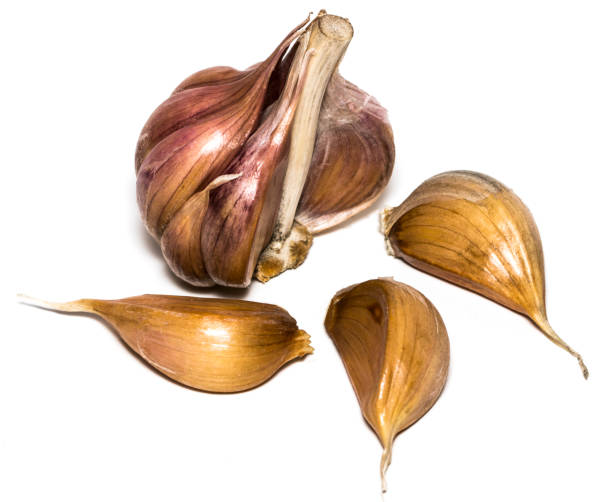 istock Fresh garlic isolated on white background close-up 867022622