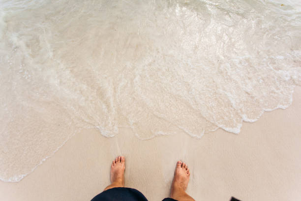 istock feet on the beautiful beach 867023044