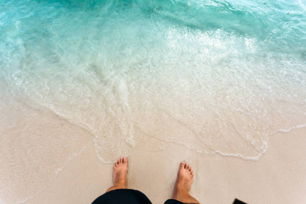istock feet on the beautiful beach 867023198