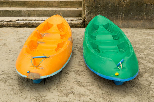 istock 2 canoe boats on the sand 867032022
