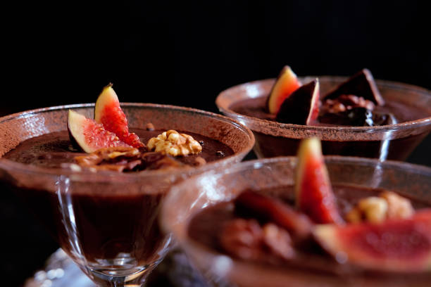 istock Chocolate mousse dessert with cinnamon, walnuts and figs served in cocktail glass 867038234