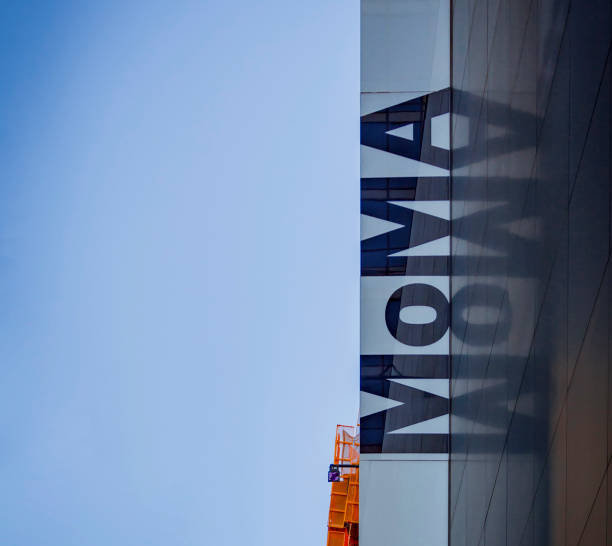 New York, USA, november 5, 2016: Museum of Modern Art vertical sign in New York reflected in a glass wall