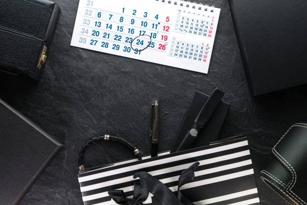 istock Package with a black bow and with gifts, different boxes, calendar 867039458
