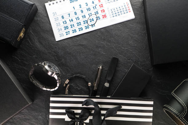 istock Package with a black bow and with gifts and a clock, various boxes, calendar 867039560