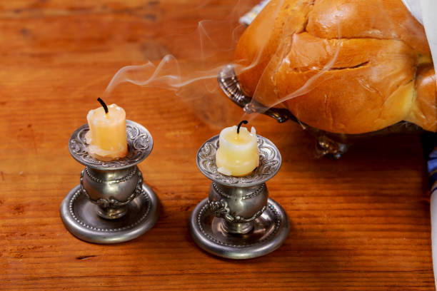 istock Sabbath image. challah bread candelas on wooden table 867043006